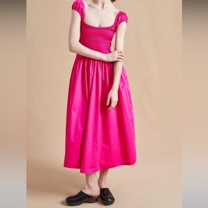 smocked bodice cap sleeves worn up or off the shoulders round skirt w pockets